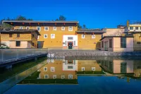 Yongding Earth Building Duilu · Shengheng Building World Heritage Home Stay