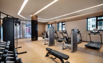 The room is spacious and contains multiple exercise equipment, as well as an indoor gym area at Holiday Inn Shanghai Nanjing Road