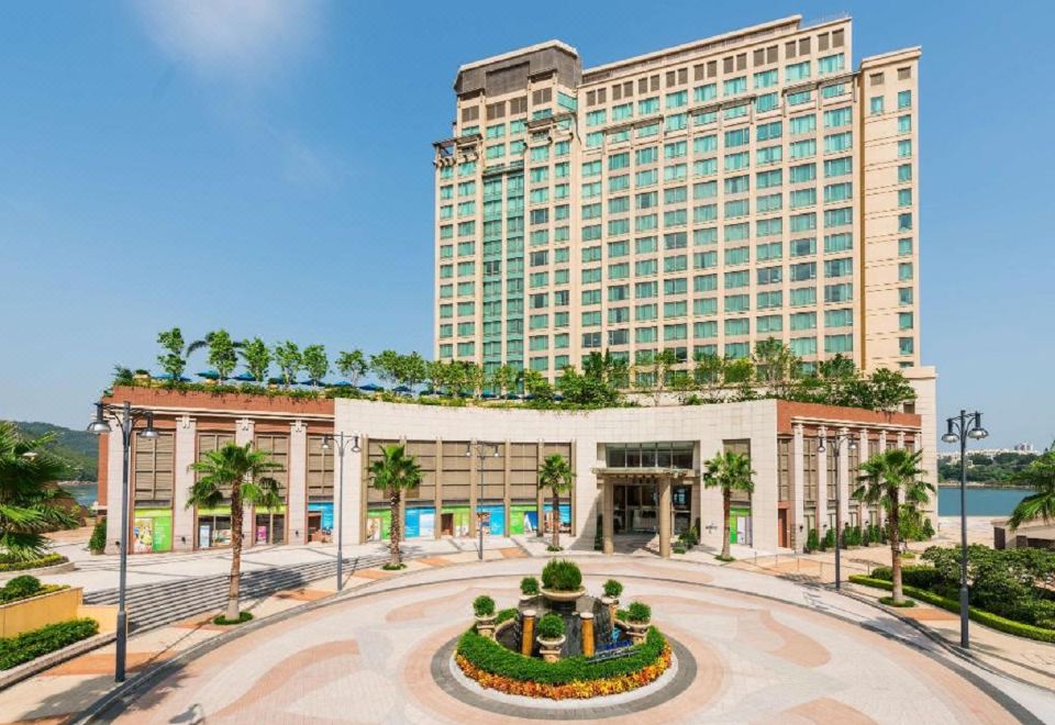 The large building has an exterior view and its entrance is located in the front at Auberge Discovery Bay Hong Kong