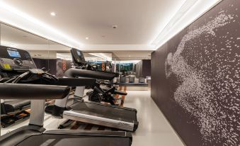 The home features a spacious gym with ample space for movement, as well as an indoor pool at CitiGO Hotel Jing'an Shanghai