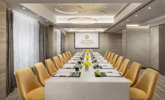 A spacious conference room equipped with a long table and chairs is available for meetings and other business events at Park Hotel Hong Kong