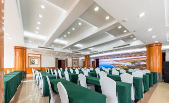 A spacious conference or meeting room is arranged with tables and chairs for an event at Golden Eagle Hotel (Yuexiu Park Xiaobei Subway Station)