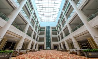 The large building features a glassed-in ceiling on both floors, with a lobby and main entrance at Continental Bridge Convention Centre Lianyungang China