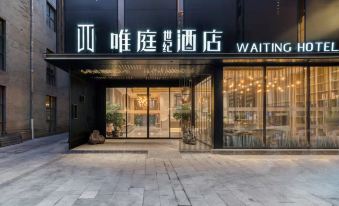 The restaurant has an illuminated sign above its glass fronted door at the entrance at Weiting Century Hotel