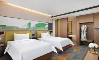 The bedroom features modern double beds and a spacious walk-in closet with a dressing area at Hampton by Hilton Yiwu International Trade Market