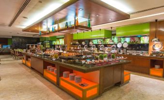a large buffet - style restaurant with a variety of food options , including fruits , vegetables , and desserts at Concorde Hotel Shah Alam