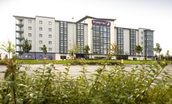 "a large , modern hotel with a sign that reads "" premier inn "" on the front of the building" at Dublin Airport