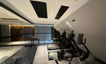 The gym offers a large treadmill and an indoor exercise area for guests at UrCove by HYATT Hangzhou Westlake