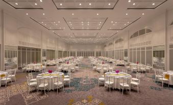 a large banquet hall with multiple round tables and chairs set up for a formal event at Dusit Thani Hua Hin