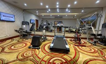 There is a spacious room in the center that includes an exercise area and floor-to-ceiling windows at Metropark Jichen Hotel Shanghai