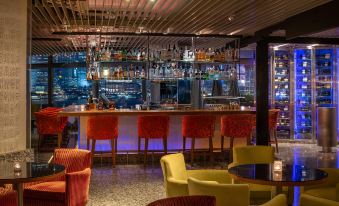 The lounge or bar area at Hotel Indigo in Nashville, TN is a stylish and inviting space for guests to relax and enjoy drinks at Marco Polo Hongkong Hotel