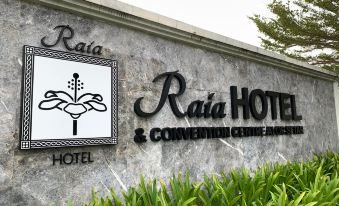 a sign for the raia hotel and convention centre is displayed on a stone wall at Raia Hotel & Convention Centre Alor Setar