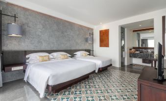 The hotel's main living area features a spacious bedroom with double beds and a tiled floor at Hotel Vellita Siem Reap