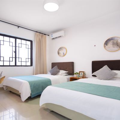 踏春園景雙床房 蕉葉民宿（三亞免税城店）優惠