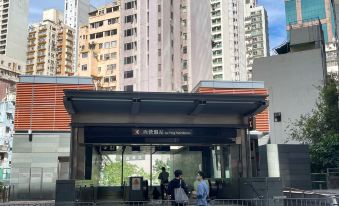 An underground entrance to a city with pedestrians walking in front and on both sides at Ramada Hong Kong Harbour View