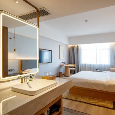 智能·禪楓新中式大床房（智能客控+自助洗衣房+停車場） 新明珠國際飯店（東莞石碣嘉榮購物廣場店）優惠