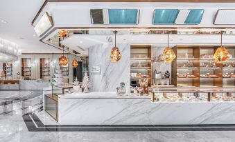 The restaurant features ample counter space in the center, accompanied by an open concept kitchen at The Langham, Shenzhen
