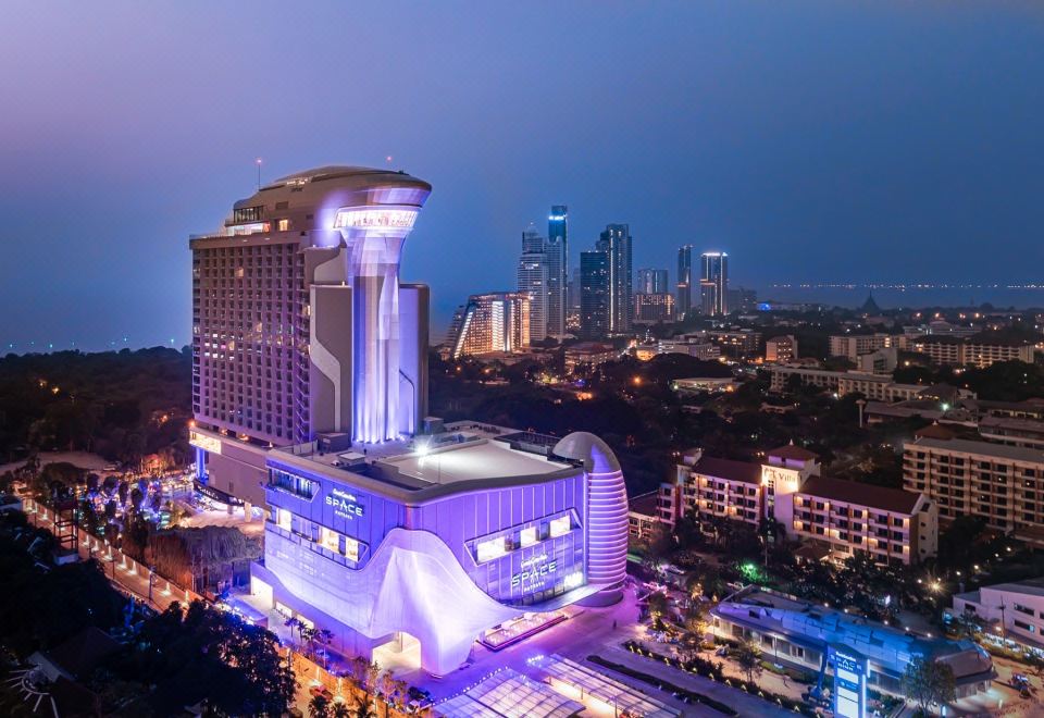 The nighttime view from the rooftop showcases the multitude of diverse types and colors present in the surrounding area, creating a vibrant atmosphere at Grande Centre Point Space Pattaya