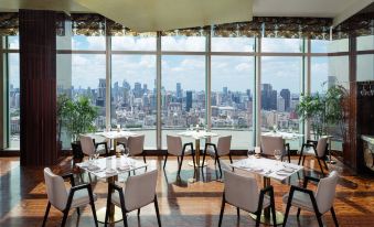The restaurant offers a scenic view of the city through its large windows and has tables that can accommodate up to 10 people at Pudong Shangri-La, Shanghai