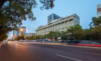 A large building is situated on a street with office complexes on both sides at Fortune Hotel