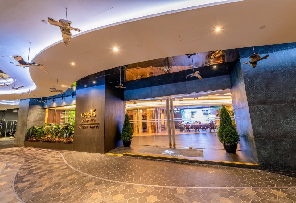 The modern hotel features a lobby that provides access to the main building and other rooms at OASIS AVENUE – A GDH HOTEL