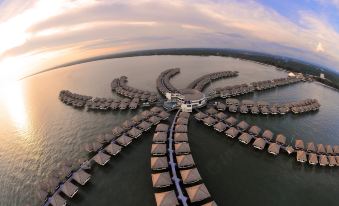 aerial view of a large group of floating houses on the water , surrounded by water at Avani Sepang Goldcoast Resort