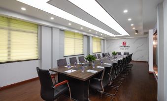 There is a spacious conference room equipped with long tables and chairs suitable for meetings and other business events at European Style Theme Smart Hotel (Yiwu International Trade City District 2 and 3)