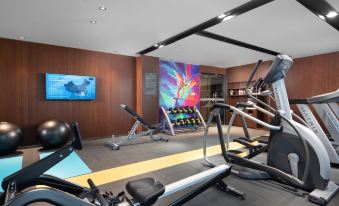 The room is spacious and contains multiple exercise equipment, as well as an indoor gym area at Hampton by Hilton Yiwu International Trade Market
