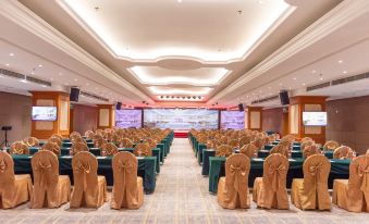 A spacious ballroom is arranged with tables and chairs for an event at Vienna International Hotel (Shenzhen North Railway Station)