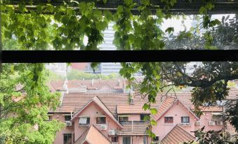 The view from a window in a person's house in Taiwan includes red brick buildings at URBN Boutique Shanghai
