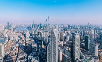 urban cityscape, showcasing the impressive architectural structures and bustling city life at Conrad Shanghai