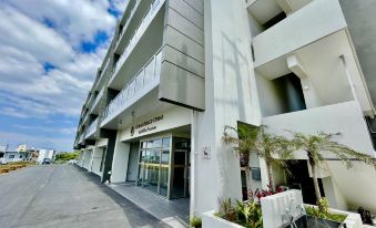 Coral Palace Onna by Sunset Avenue - Housity