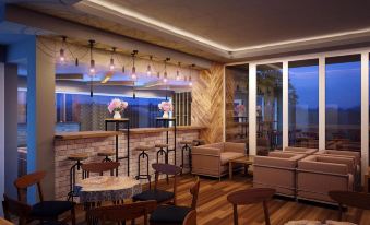 a modern restaurant with wooden furniture , including tables and chairs , and a bar area at Gold Hotel Hue