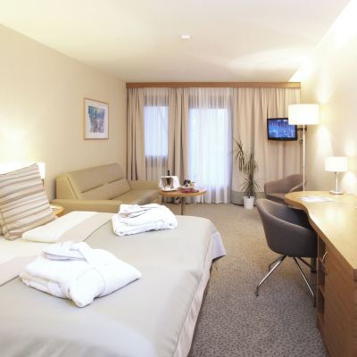 Comfort Quadruple Room with Balcony and Garden View Seehotel Rust Promo Code