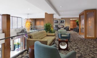 a hotel lobby with a variety of seating options , including couches , chairs , and a coffee table at The Moonrise Hotel