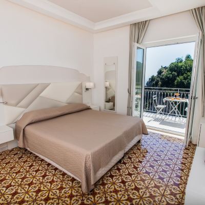 Deluxe Triple Room with Sea View Hotel le Rocce Promo Code