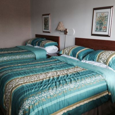 Standard Room With One Queen Bed And One Double Bed Fortress Inn Louisbourg Promo Code
