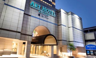 "a large hotel with a modern design and the name "" art hotel "" displayed above the entrance" at Art Hotel Miyazaki Sky Tower