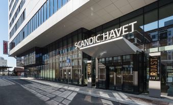 "a building with the words "" scandic havnet "" prominently displayed on its facade , along with the name of the store" at Scandic Havet