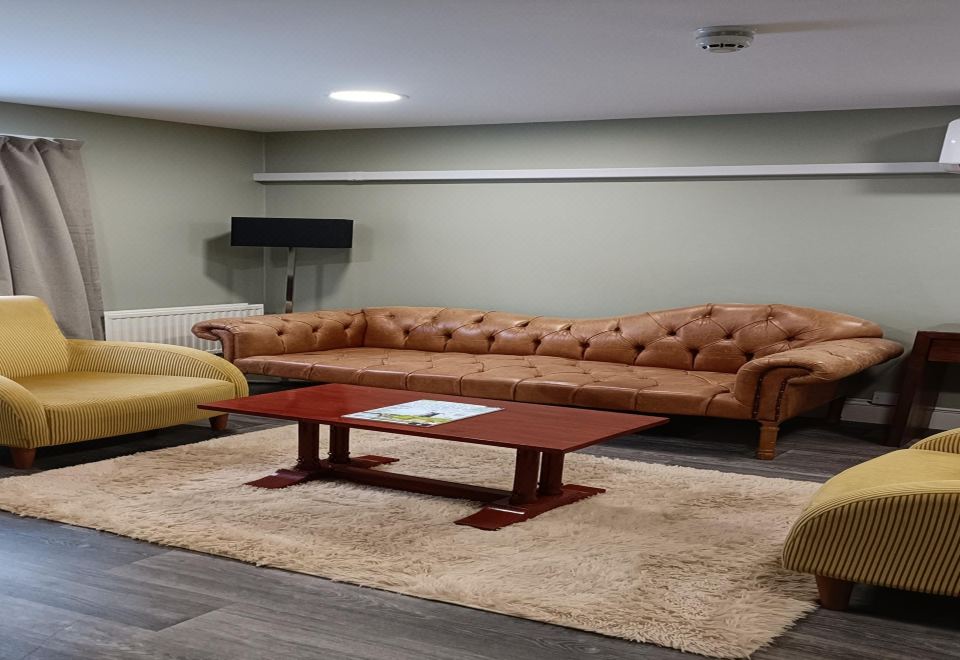 Suite-1 King Bed, Non-Smoking, Sitting Area, Shower Only