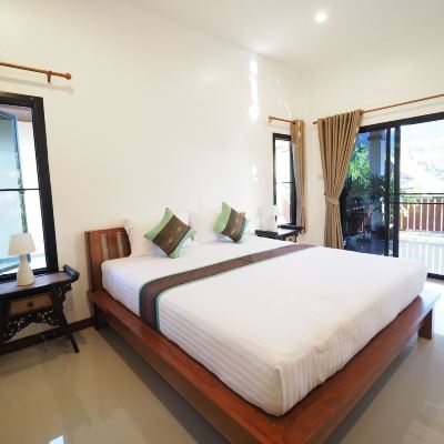 ห้องมาตรฐานพร้อมวิวสวนและระเบียง รหัสโปรโมชั่น ชนาภา เรสซิเดนซ์