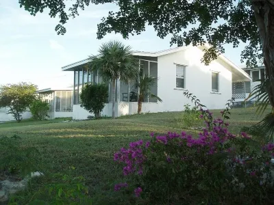 On hilltop with pool. Only 400 feet down to waterfront, dock & kayaks. Hotels in 