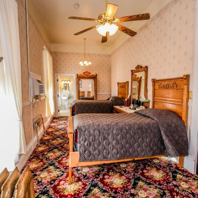 Historic 1 Queen Bed; 2 Singles (2nd Floor) Irma Hotel Promo Code