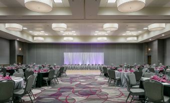 a large conference room with multiple tables and chairs , all set up for an event at Courtyard Omaha Bellevue at Beardmore Event Center