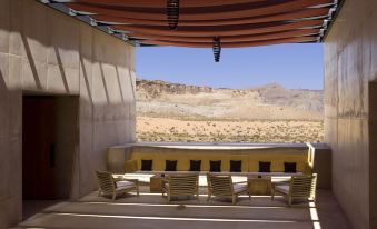 a patio area with a brown tarp covering the roof , creating a shelter for outdoor dining and socializing at Amangiri