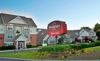 a large red sign for the residence inn by marriott is displayed in front of a building at Residence Inn Bridgewater Branchburg