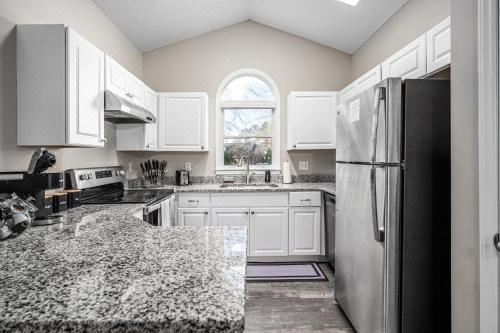 Cozy Industrial Kildaire Farms Home- Near DowntownThree-Bedroom Bungalow