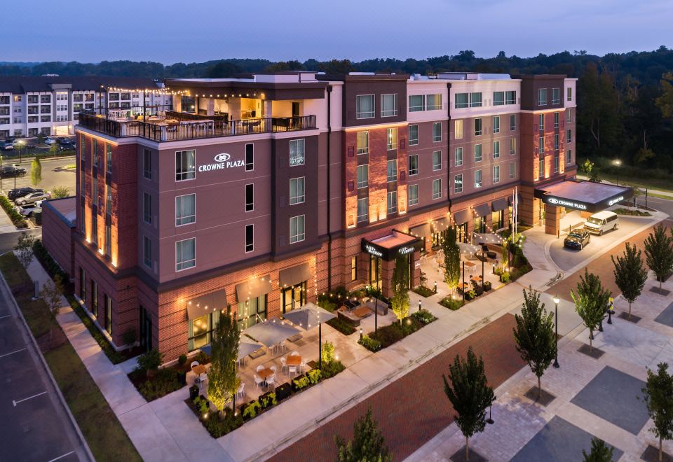 an aerial view of a large hotel building with multiple stories , located in a city at Crowne Plaza North Augusta