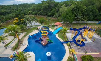 a large outdoor water park with multiple slides , pools , and play structures for children to enjoy at Amverton Heritage Resort