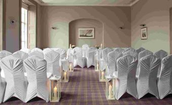 a large room with rows of chairs arranged for a wedding or other formal event at Actons Hotel Kinsale